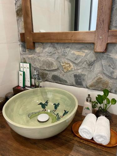 a bathroom with a bowl sink on a counter at Mai Châu Home in Mai Châu