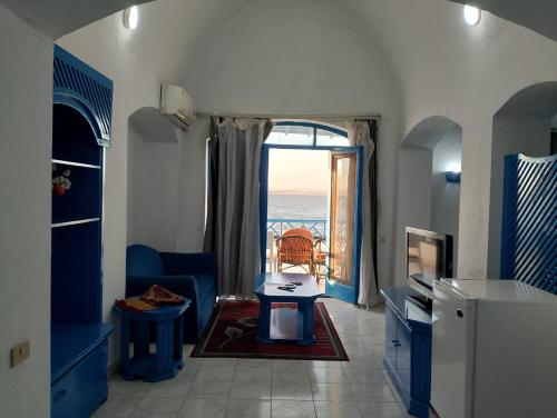 a living room with a view of the ocean at New Panorama Resort in Fayoum