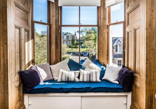 a window seat in a room with pillows at The Neuk in North Berwick