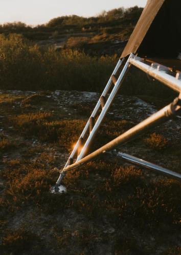a ladder sitting on the ground in a field at K-Tent 1 in Treknow