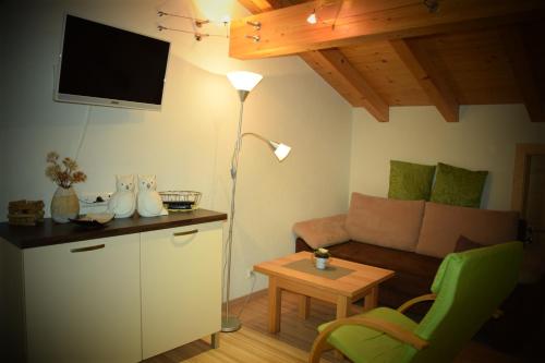 a living room with a couch and a table at Apart Dominika in Ried im Oberinntal