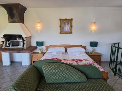 a bedroom with a bed and a table and a microwave at Hawa's Penthouse Studio with Terrace in Eferding