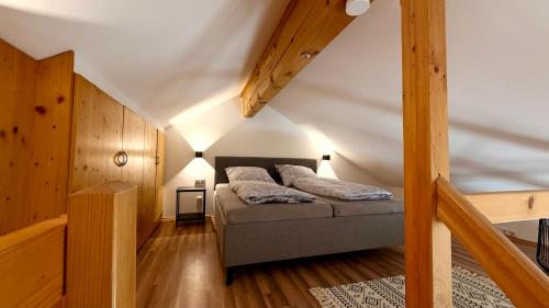 a bedroom with a bed in a attic at Ferienwohnung Am Bromberg in Schlehdorf