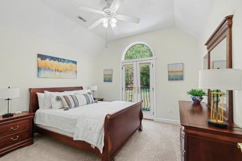 a bedroom with a bed and a ceiling fan at Chic Sky Valley Resort Home on Golf Course! in Sky Valley