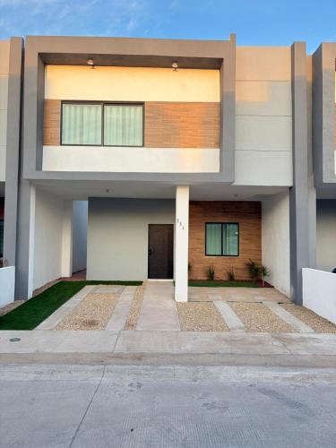 a modern house with a front view at Casa moderna, 3 recámaras, alberca, La Paz BCS in La Paz