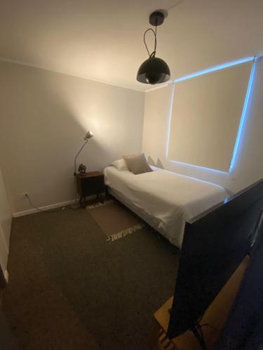 a bedroom with a bed and a tv in it at Exponor 2026 DEPARTAMENTO 1 DORMITORIO in Antofagasta