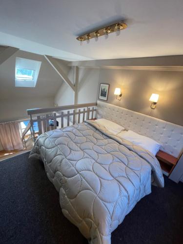 a bedroom with a large bed in a room at Bonato Hotel in Náchod