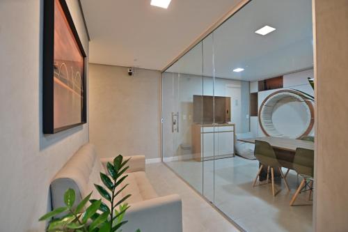 a living room with a couch and a table at Premium Office-My Stay 02 in Brasília