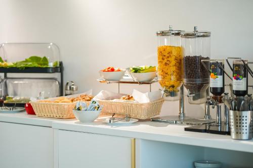 a buffet of food on a counter in a kitchen at Superior Jacuzzi Apartment Sea Side Terrace in Eforie Nord