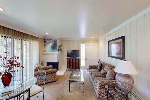 a living room with a couch and a table at Silverado Resort and Spa 374 & 375 in Napa
