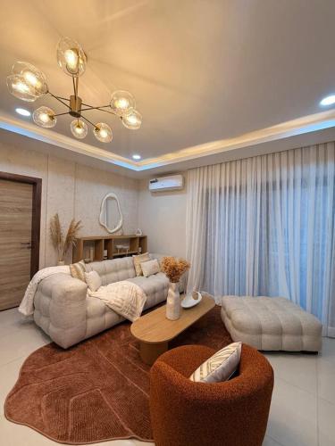 a large living room with a couch and a table at Cocon de paix à Ngor Virage in Dakar