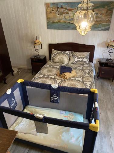 a bedroom with a large bed with a large bed frame at Casa S. Nicolau in Cabeceiras de Basto