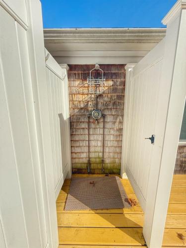 an empty hallway with a brick wall at Tranquil Oasis With Firepit in Harwich