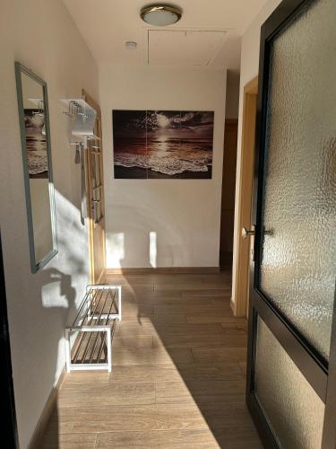 a hallway with a door leading into a room at Ferienhaus Lechseeidylle in Lechbruck