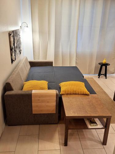 a living room with a couch and a coffee table at Yllästar 3 - Cozy Stay in Magical Lapland in Äkäslompolo
