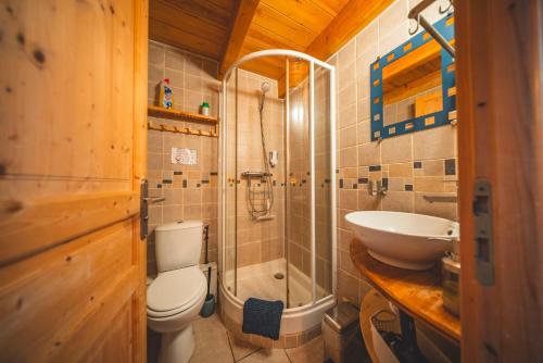 a bathroom with a toilet and a sink at La Grange de la Petite Ourse in Les Angles