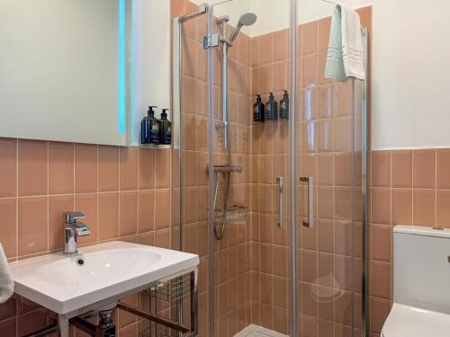 a bathroom with a shower and a sink at Birchwood Pitlochry in Pitlochry