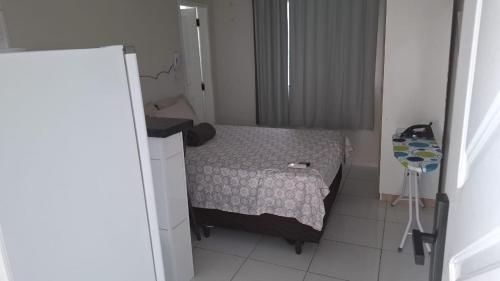 a small bedroom with a small bed in a room at my sweet place 33 in São Luís