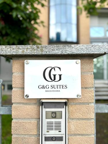 a sign for cgc suites on a building at G&G Suites in Bugia