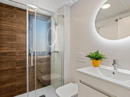 a bathroom with a shower and a toilet and a sink at Villa Del Pescador in Santiago de la Ribera