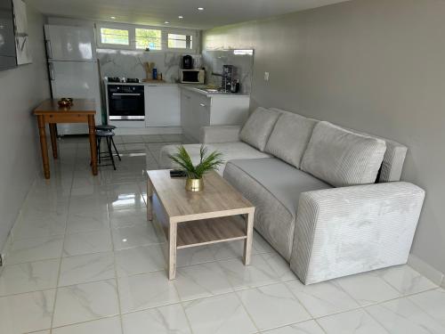 a living room with a couch and a table at Chez Lina in Chartres