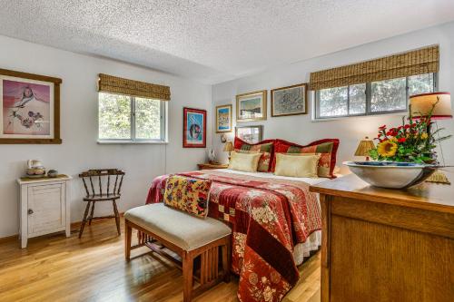 a bedroom with a bed and a table and chairs at Eclectic Multi-Level Charmer! 2 Mi to CU Boulder in Boulder