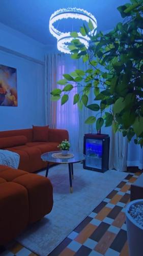 a living room with a couch and a table at CB Luxury in Kisii