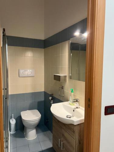 a bathroom with a sink and a toilet at LA Tulè 2 in Popoli