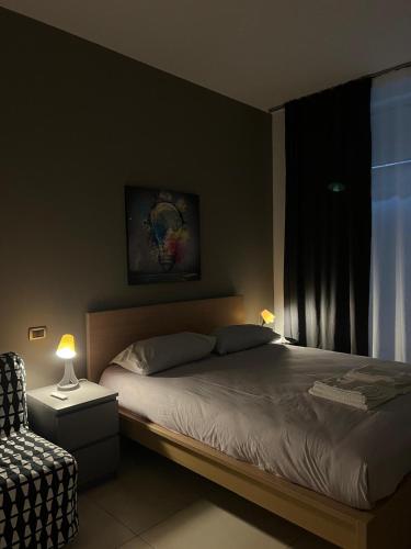 a bedroom with a large bed and a window at LA Tulè 2 in Popoli
