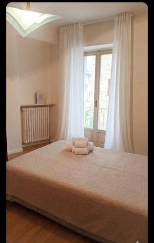a bedroom with a bed with two towels on it at Casa D&C in Avigliano