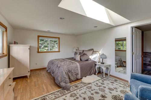 a bedroom with a bed and a skylight at Walkable, Dog Friendly! Friday Harbor Stay w/ Deck in Friday Harbor
