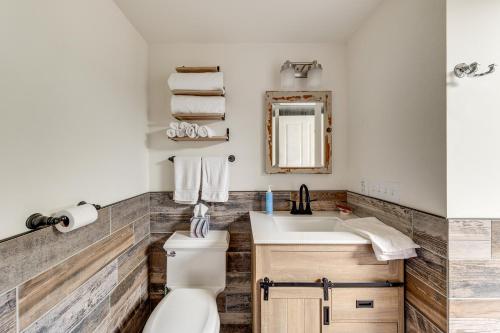 a bathroom with a toilet and a sink at Walkable, Dog Friendly! Friday Harbor Stay w/ Deck in Friday Harbor