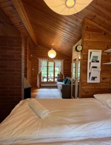 a bedroom with a large bed in a room at Villa Safari in Perniö
