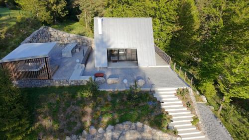 an overhead view of a house with a stone building at Pine Hill RUBY with free jacuzzi in Rakitna