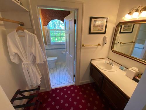 a bathroom with a sink and a mirror at Beaumont Inn in Harrodsburg
