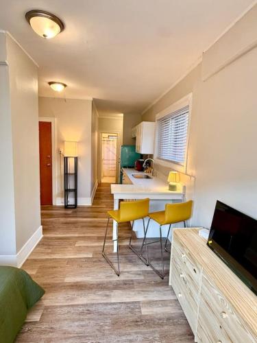a kitchen with a table and chairs in a room at Well Located Studio on the Red Line in Chicago
