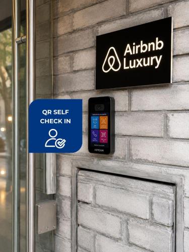 a sign on the side of a building with a cell phone at Live Soho Boutique Hotel & Apartments in Buenos Aires