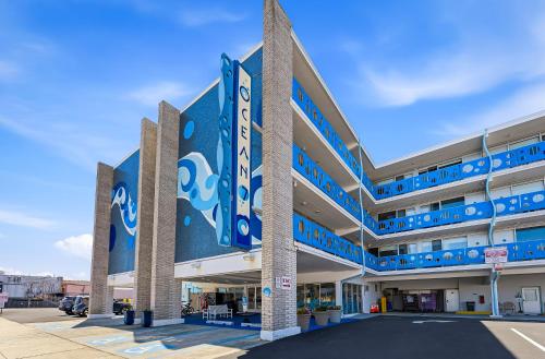 an exterior view of a large building with blue accents at Ocean 7 in Ocean City