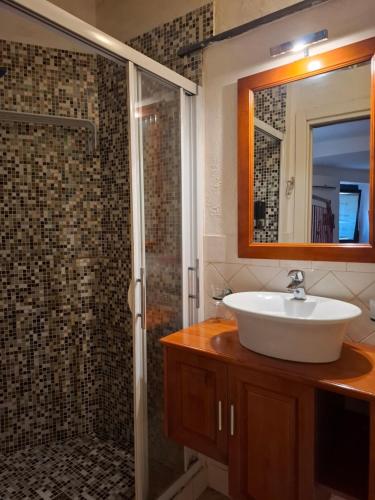 a bathroom with a sink and a shower at Suite delle Nereidi in Manarola
