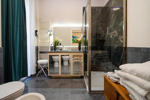 a bathroom with a shower and a sink at DibraLuxurySuites Duomo in Milan