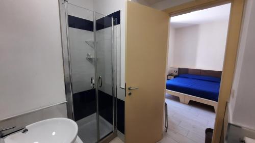 a bathroom with a shower and a toilet and a sink at BrezzaMarina in Sapri