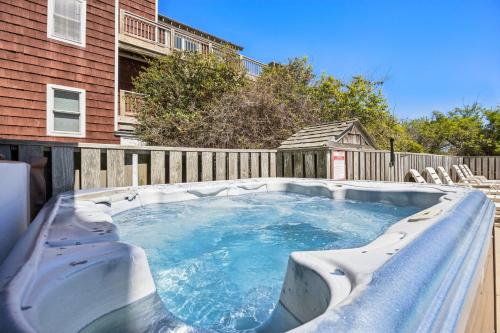 a hot tub in the backyard of a house at 6107 - No Wake Zone in Nags Head