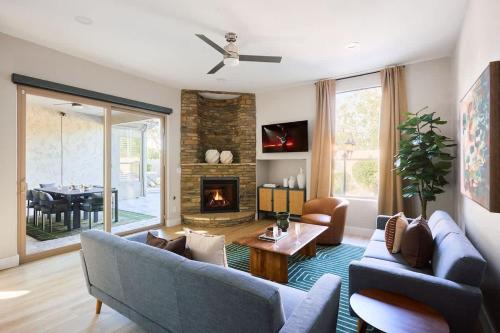 a living room with a couch and a fireplace at Citrus-Pool & Spa-Walk 2 restaurants, shops & bars in Phoenix