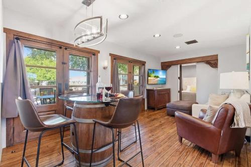 a kitchen and living room with a table and chairs at Rhone - In Old Town - Walk to Fashion Square in Scottsdale