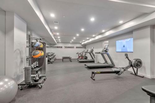 a gym with several treadmills and machines in a room at Hyve - Mahogany - Walk to Broadway in Nashville