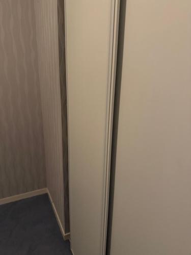 a white door in a room with a hallway at Orléans passe in Olivet