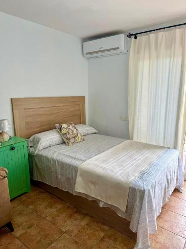 a bedroom with a bed and a window at Luis Vives in Benalmádena