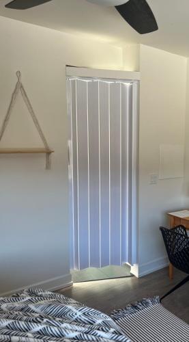 a sliding glass door in a room with a rug at Hikari-Okanagan Sunshine B&B in Kelowna