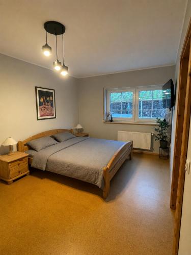 a bedroom with a large bed and a window at Ferienwohnung Haus Liane in Reil