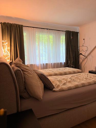 a bedroom with two beds and a window at LevelUp Comfort in Koblenz
